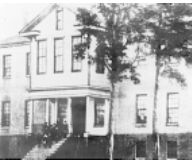 A black and white image of a large building