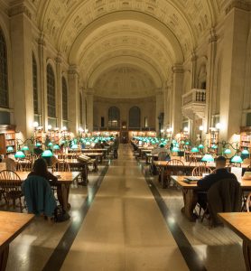 The seminal arched reading room of the Boston Public Library provides the main gathering space for patrons.